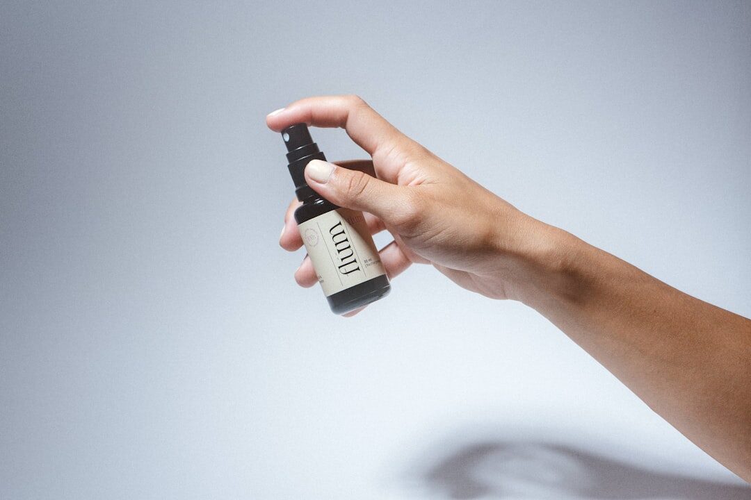 Repellent going on exposed skin — with dengue about and no realistic vaccine for a short trip, not getting bitten is the whole game.