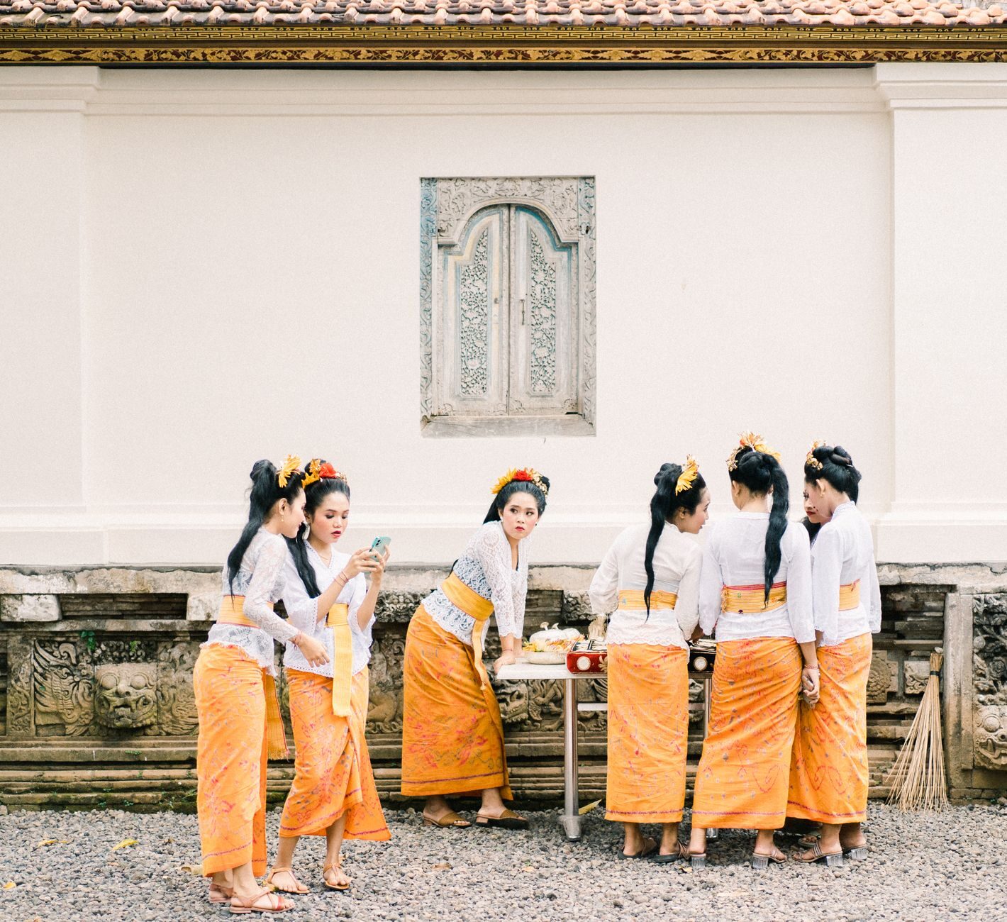 The sash knotted over the sarong, close up. Most big temples lend both at the entrance, so you're never stuck.