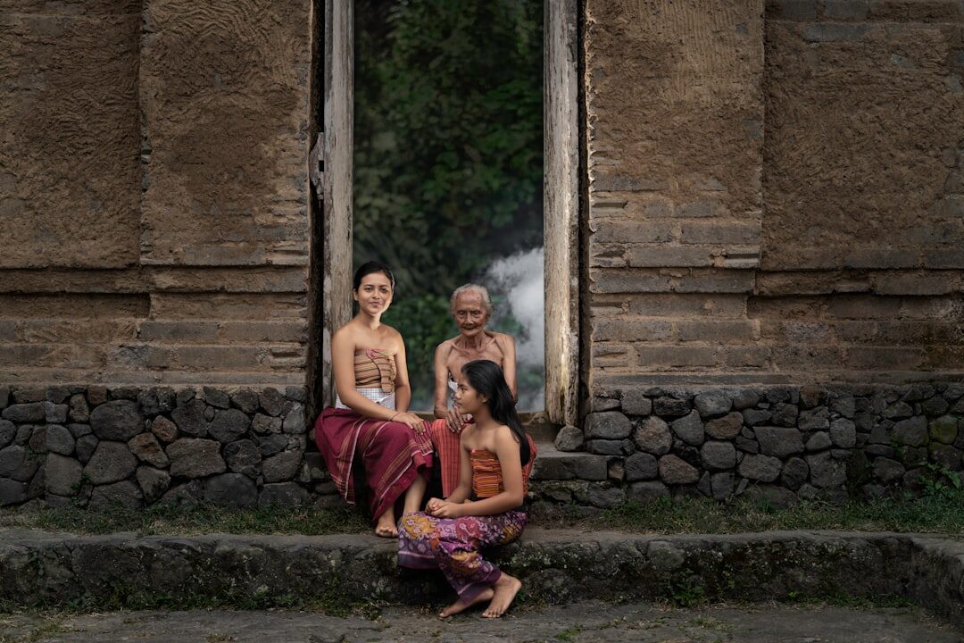 Sarongs worn simply, off-duty — a length of cloth that weighs nothing and covers the legs the moment you need it.