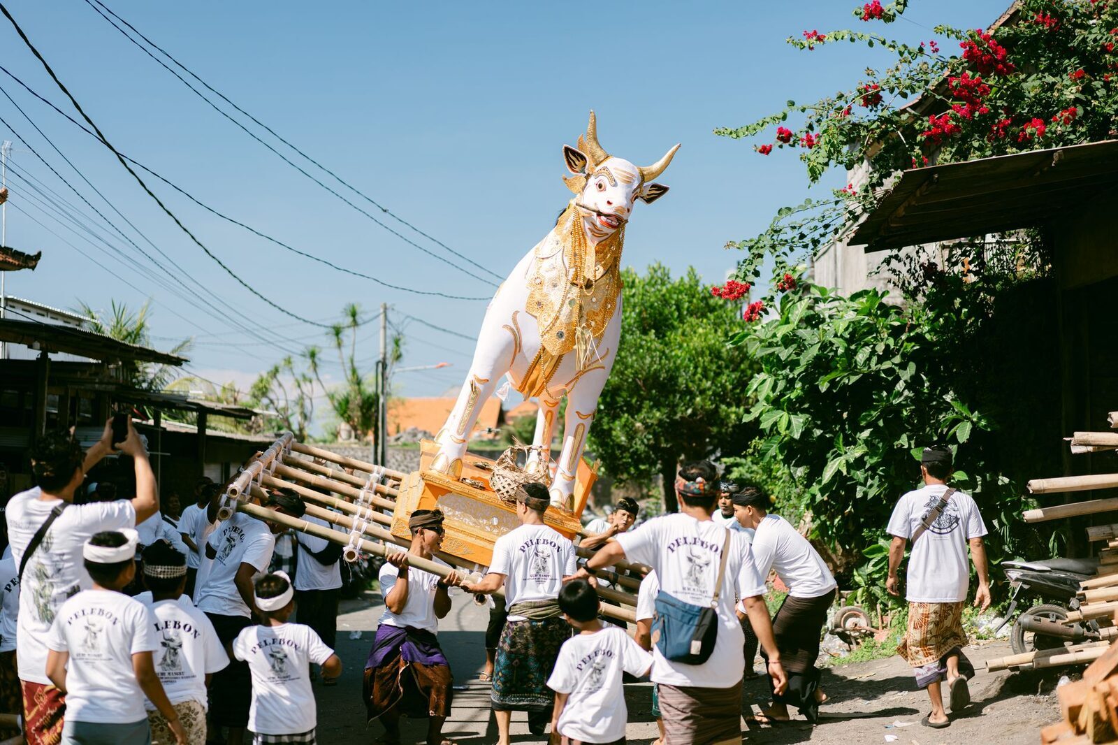 The white bull-shaped sarcophagus carried through the street at a ngaben — the body is placed inside it for the cremation.