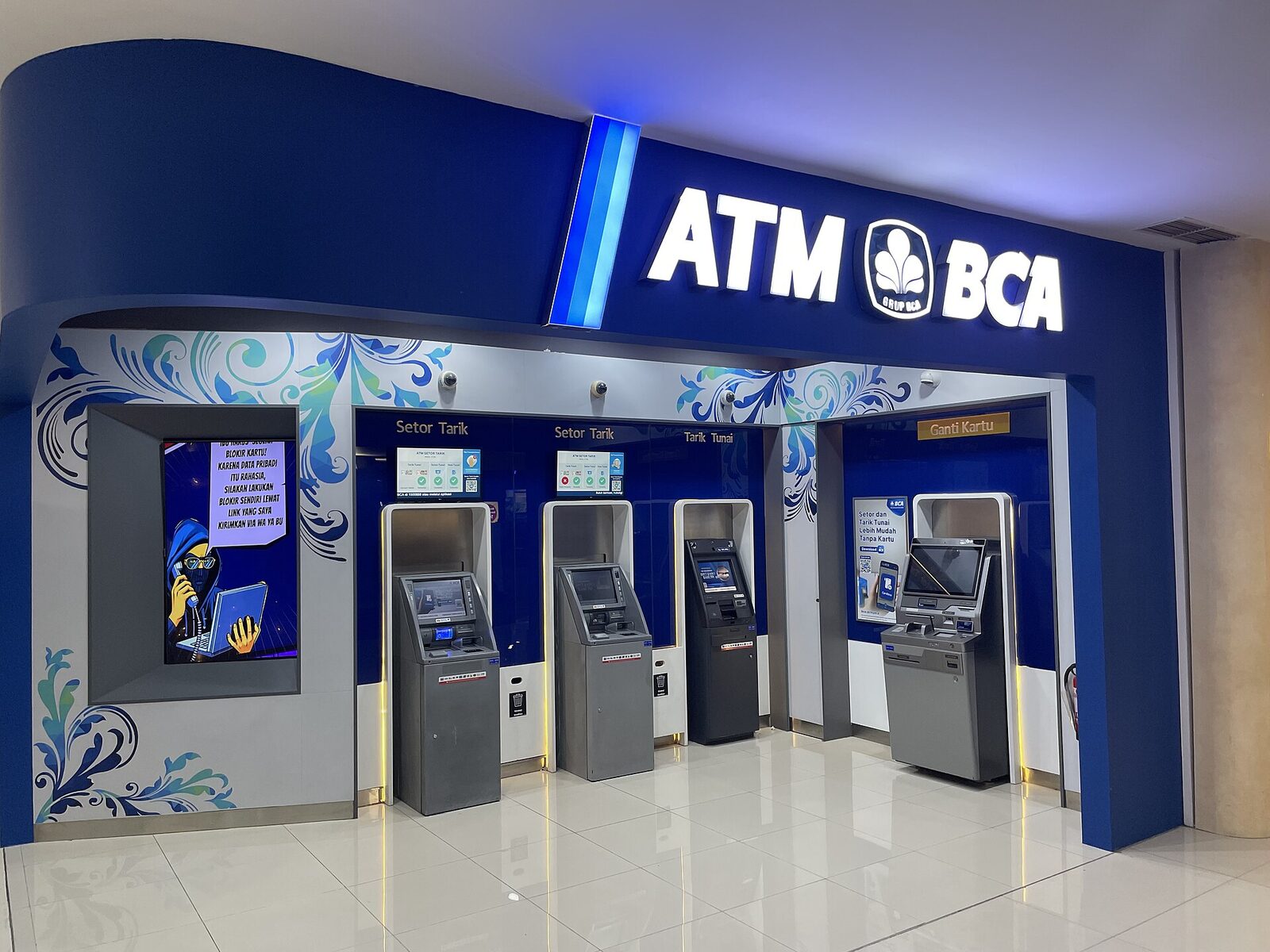 A row of BCA ATMs inside a bank branch — exactly where you want to be. BCA, Mandiri and BNI are the big names; a machine attached to a branch, in view of staff, is far harder to rig.
