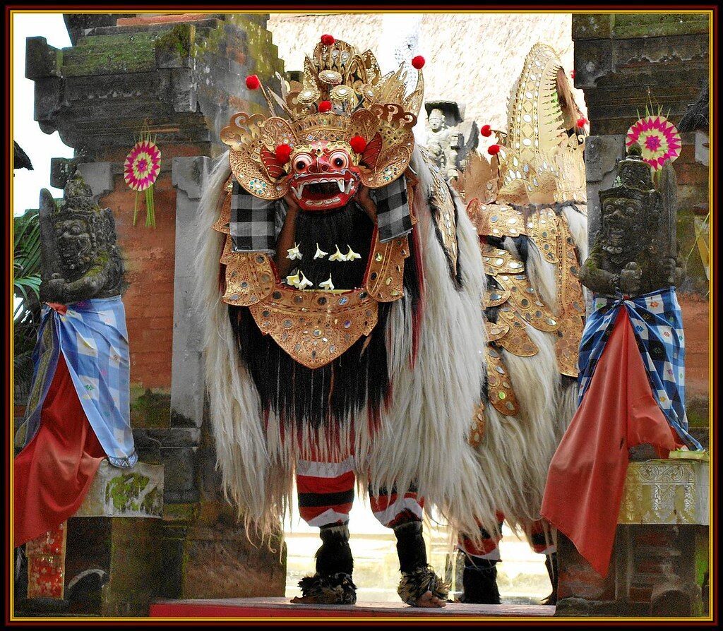 A Barong figure framed in a temple gateway.