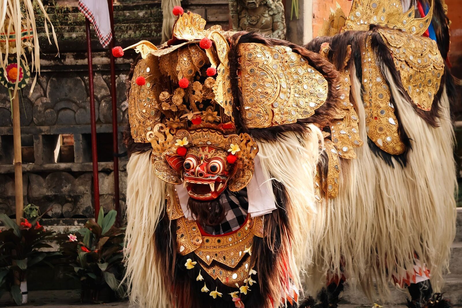 The Barong — the shaggy, lion-like protective creature, worn by two dancers.