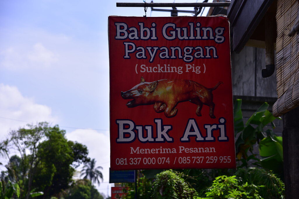 A roadside sign for a babi guling warung — the suckling-pig specialists worth seeking out.