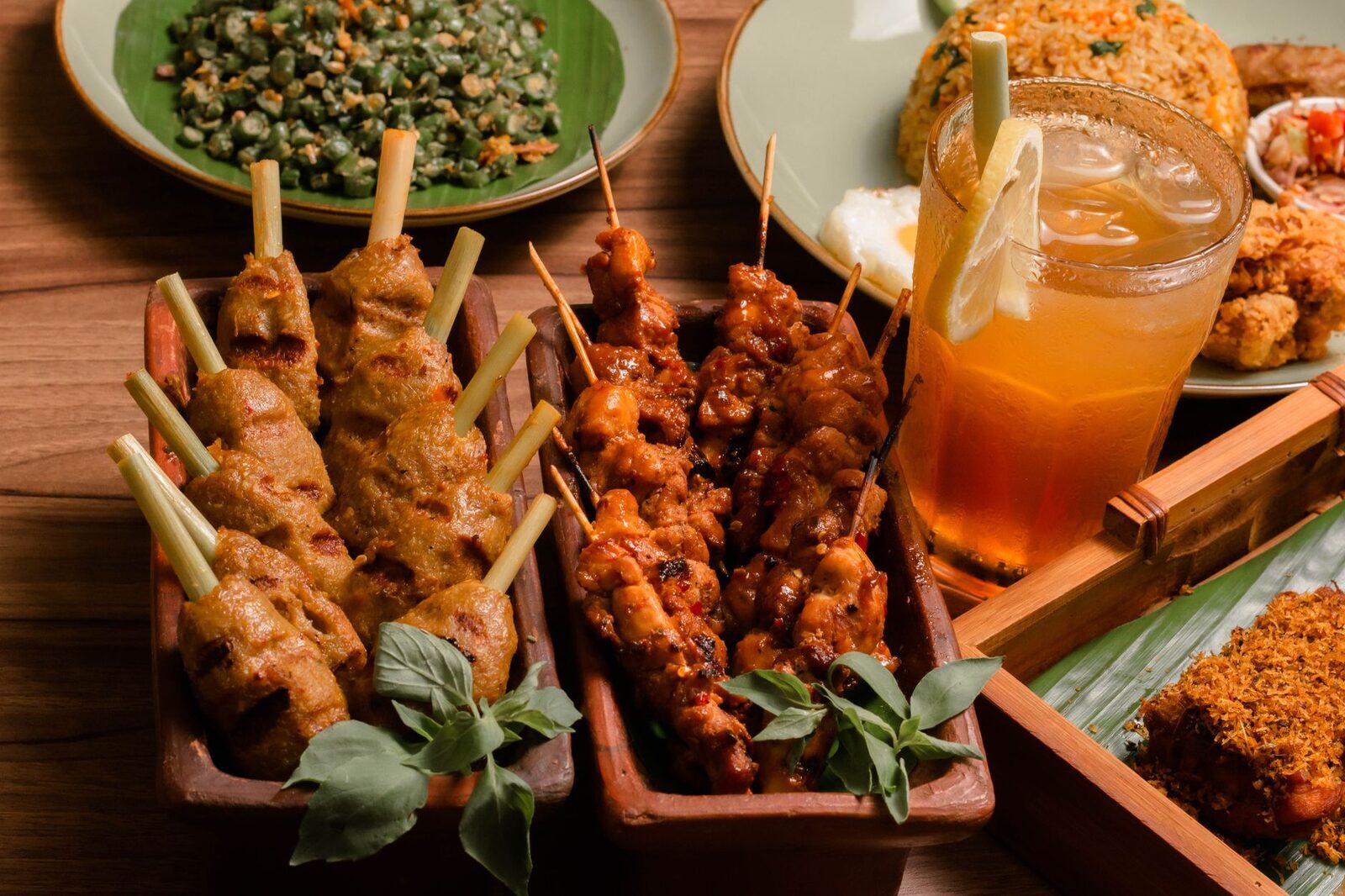 Sate lilit boxed up with a drink, ready to eat.