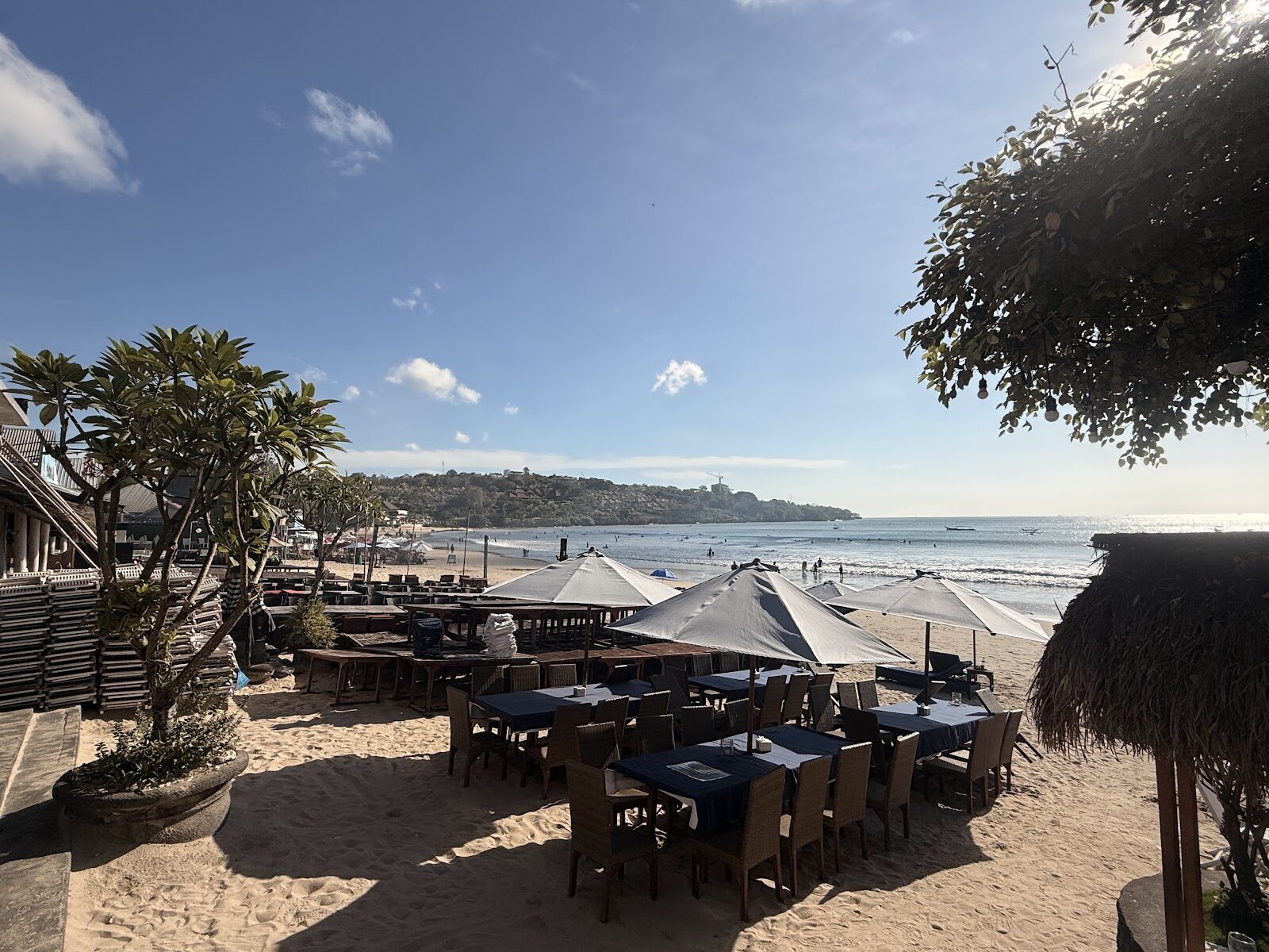 Tables set out on the sand at a Jimbaran beachfront seafood place.