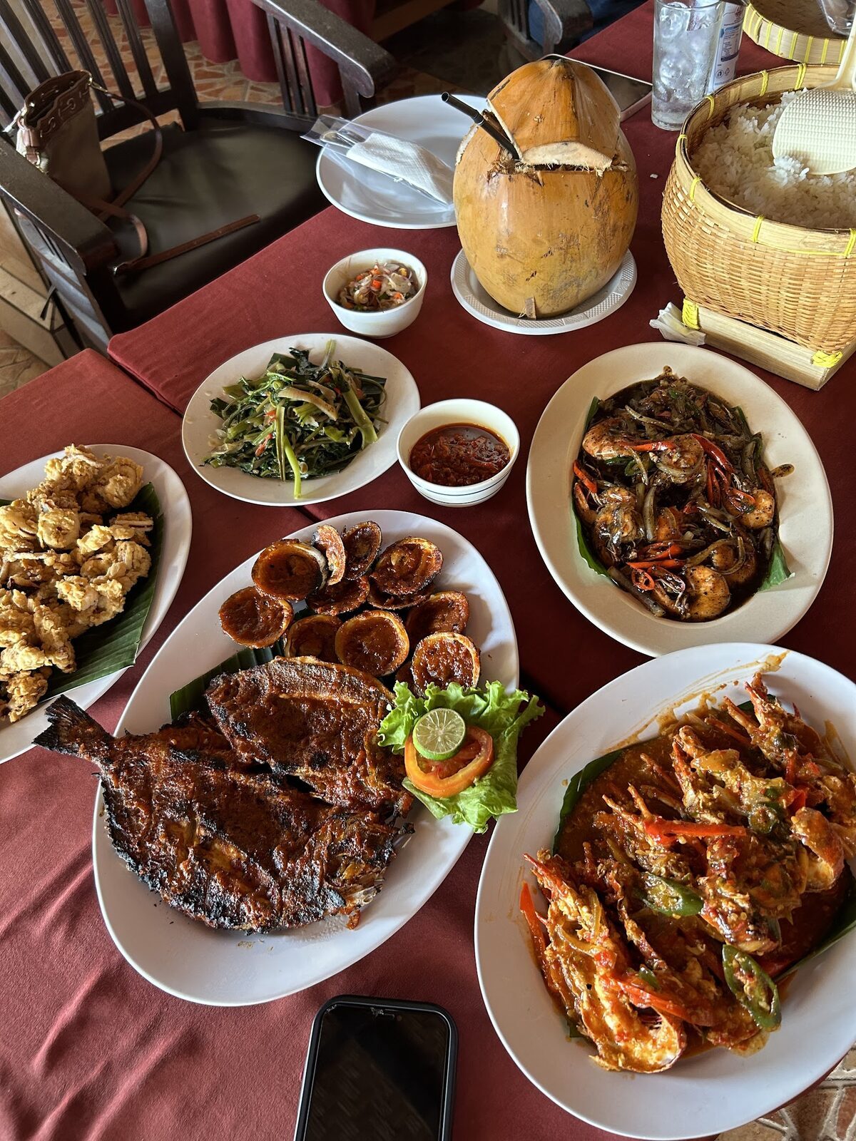 A spread of grilled seafood and sides brought to the table.