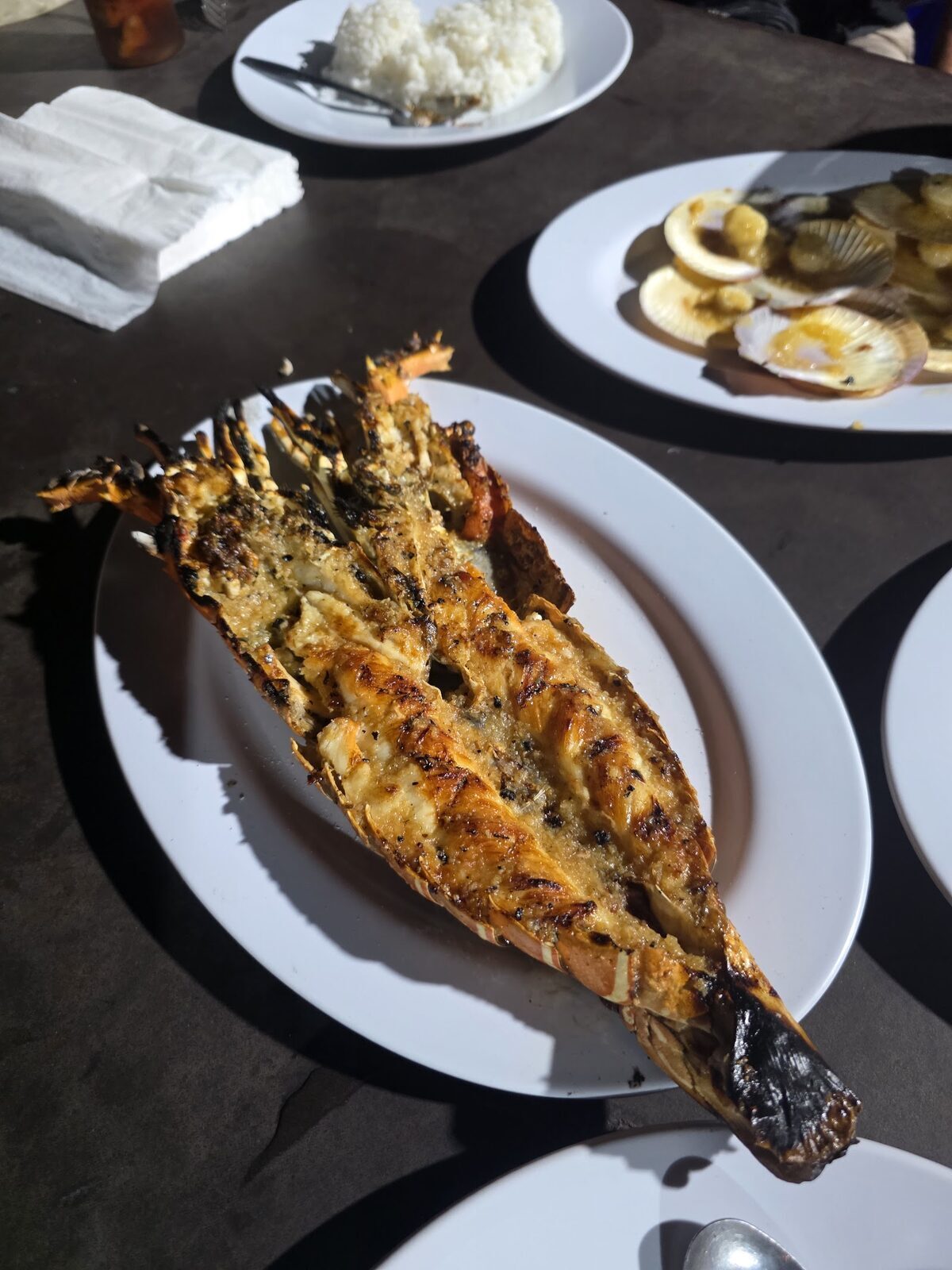 A whole fish grilled with sambal — the Jimbaran house style.