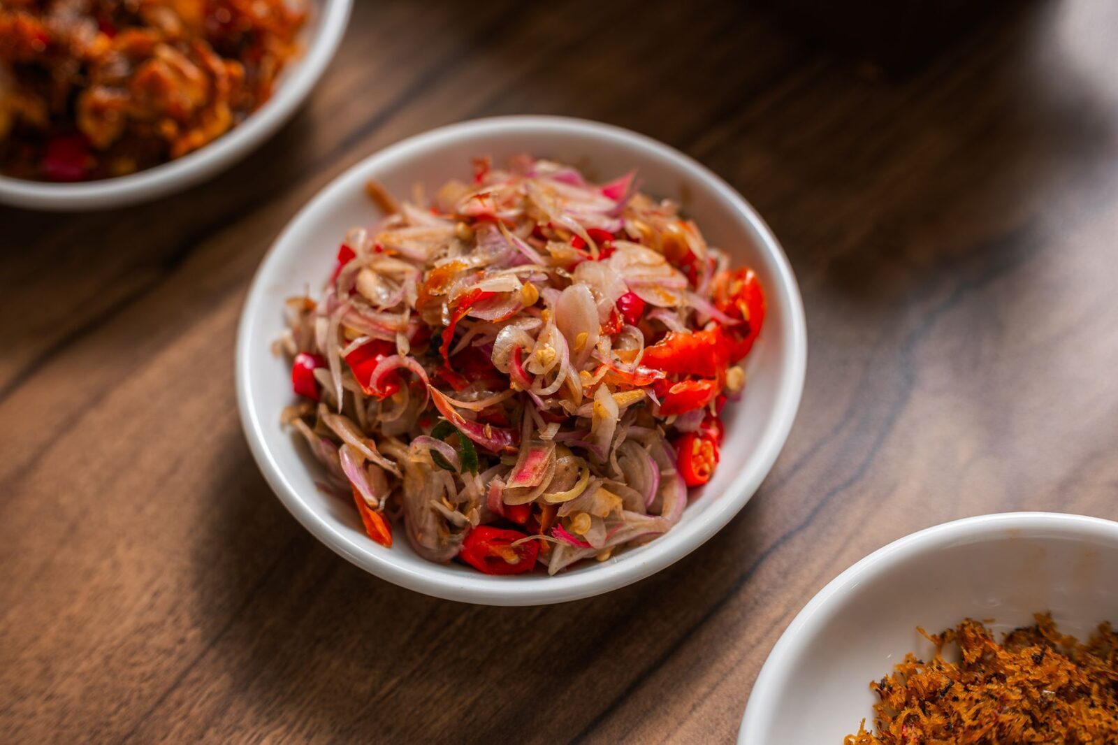 Chopped and dressed the Balinese way — herbal, coconut-rich and chilli-hot.