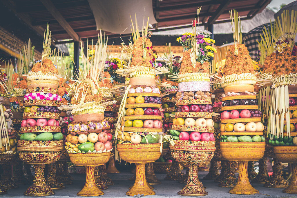 Gebogan — tall towers of fruit, cakes and flowers carried to the temple on feast days, a grander cousin of the daily canang.