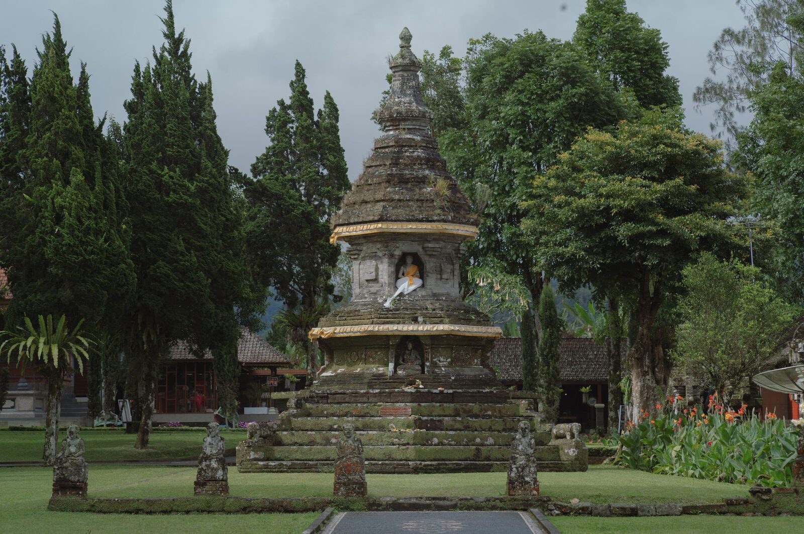 A stone shrine set among the quiet, green terraced gardens.