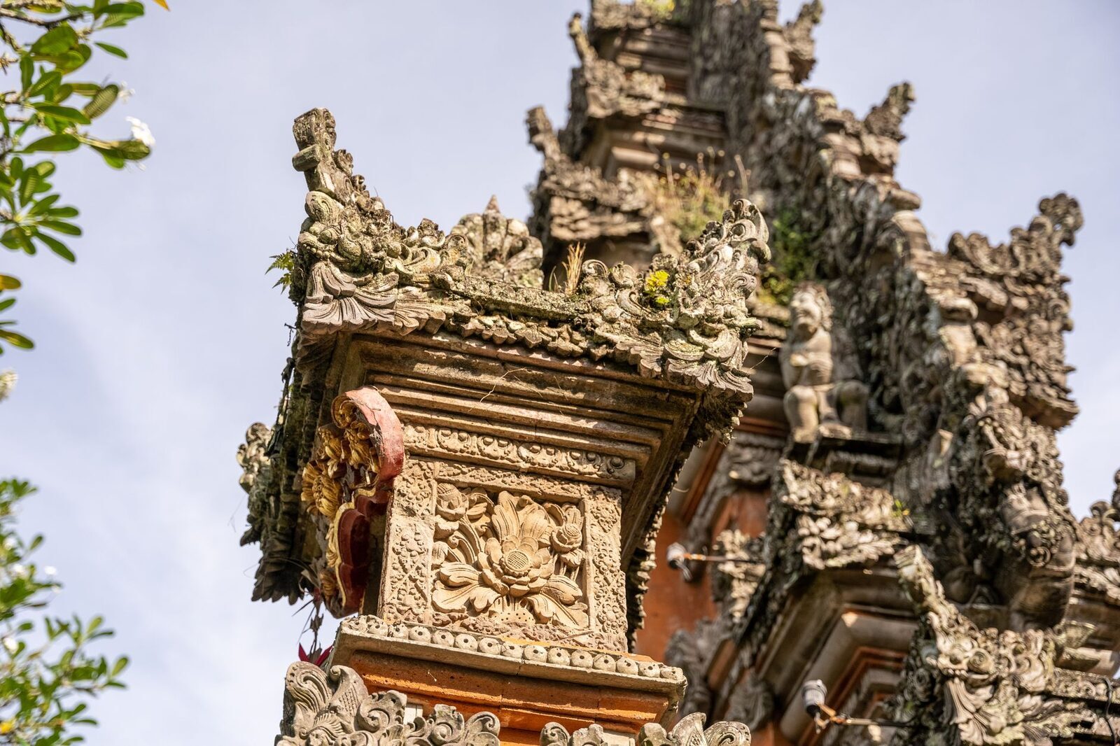 The gilded stonework of a Besakih shrine, carved in close detail.