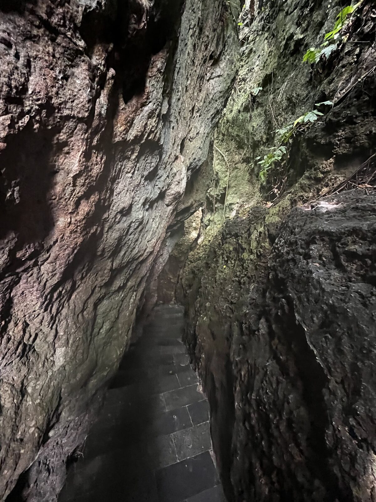The narrow rock cleft you climb down to reach Padang Padang's beach.