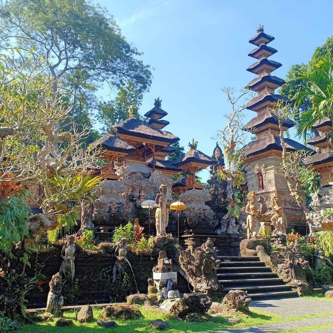 The temple courtyard and its tiered meru shrines, down in the river gorge.