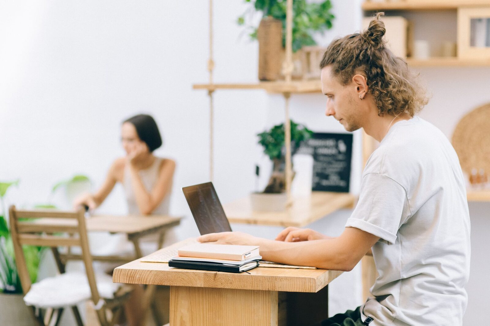 Heads down on laptops in a cafe — fine by day, variable by evening.