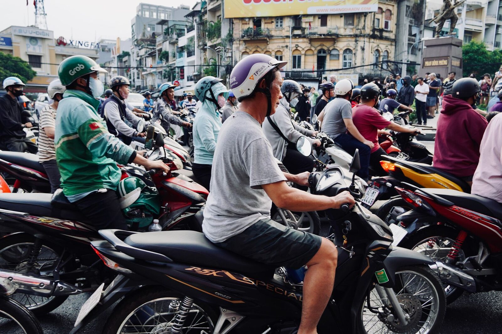Scooters nose to tail in a jam — the daily reality of the crowded south.