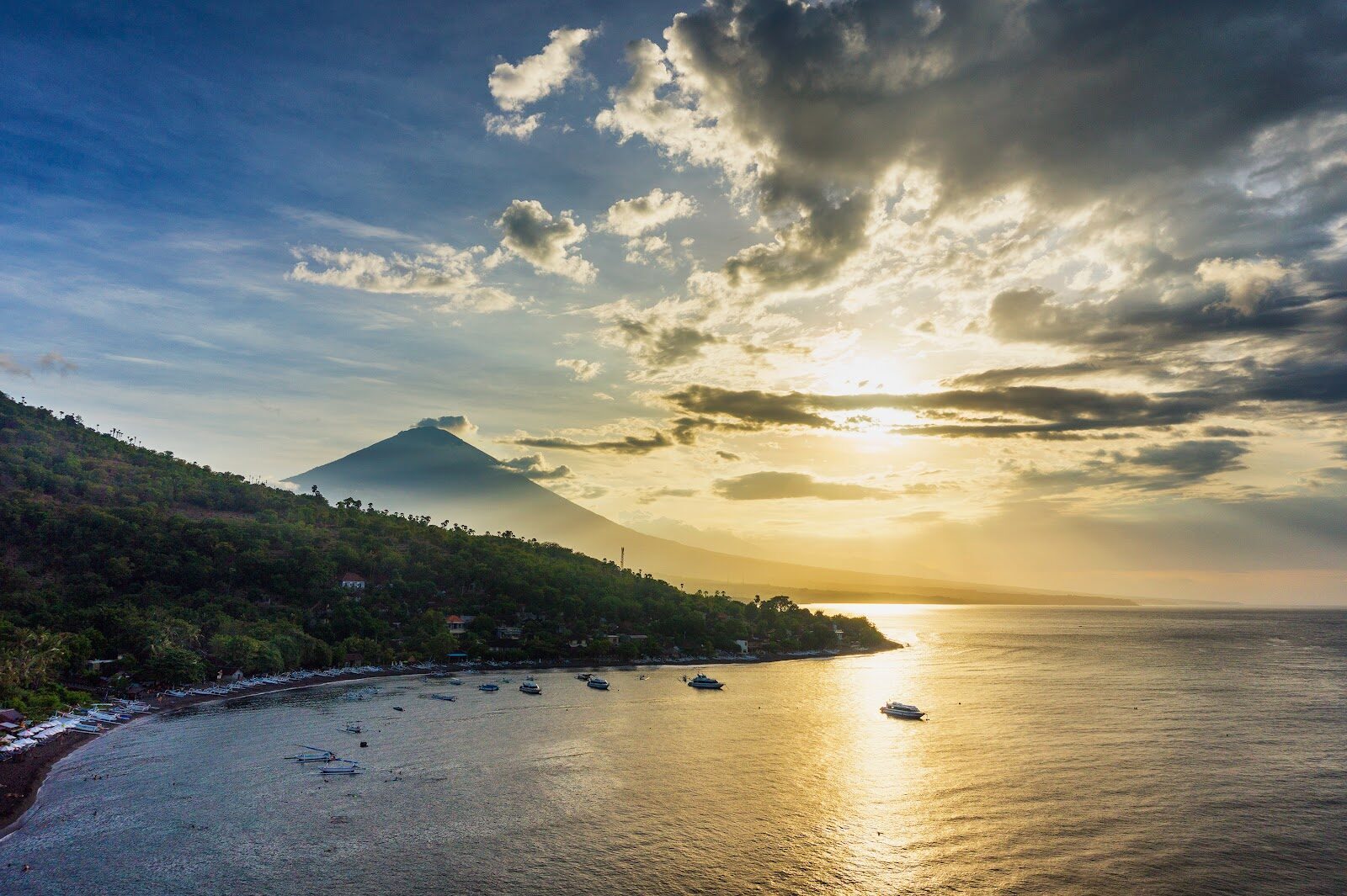Sunrise over the bay, the volcano in silhouette.