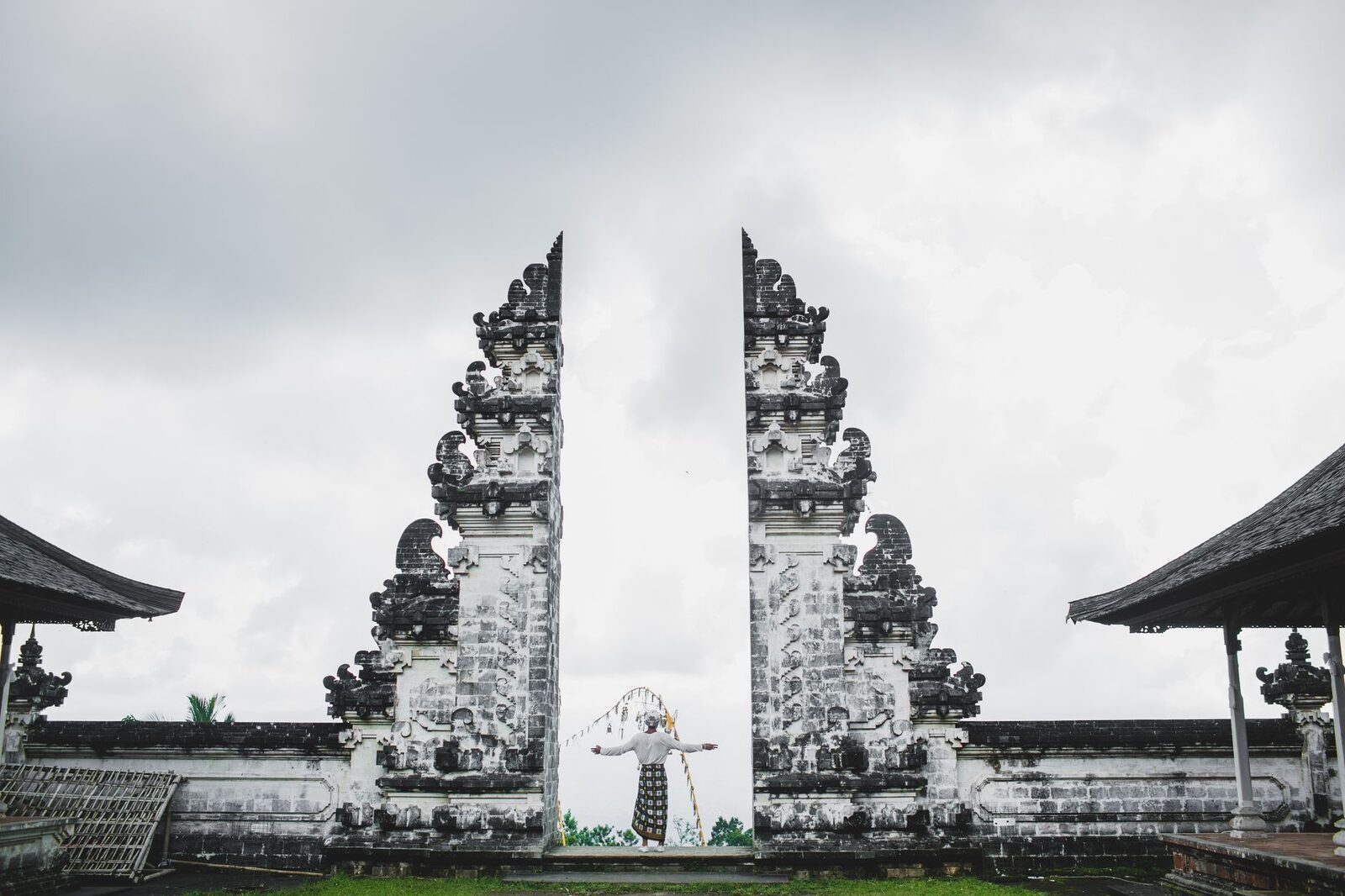 The gateway with a small shrine between the towers on an overcast day.