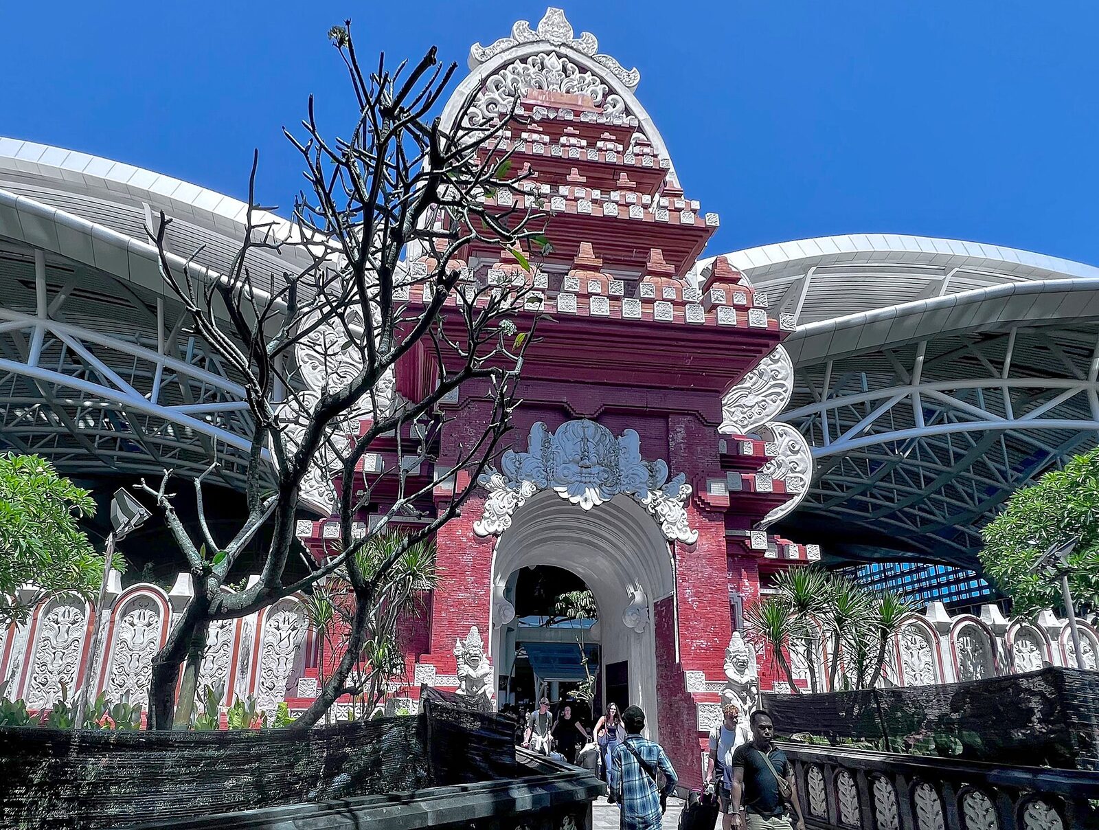 The candi bentar gateway at the airport, the Balinese welcome before the taxi touts.