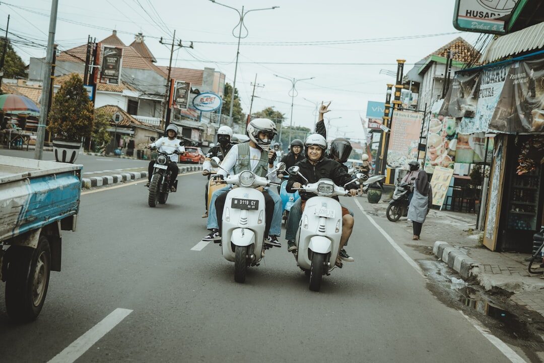 A cluster of Vespas riding the open road between the jams.