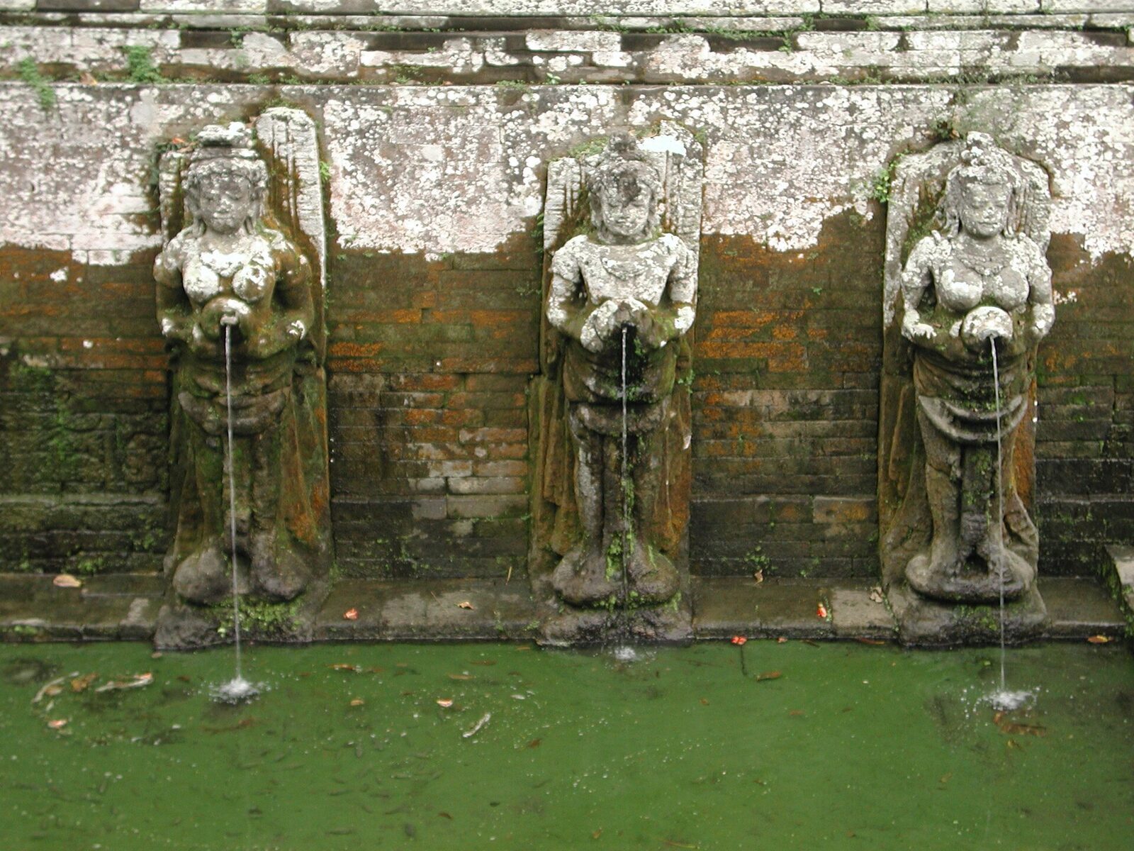 The bathing pool's stone figures pouring water from their urns — excavated only in the 1950s, and the most photogenic part of the site.
