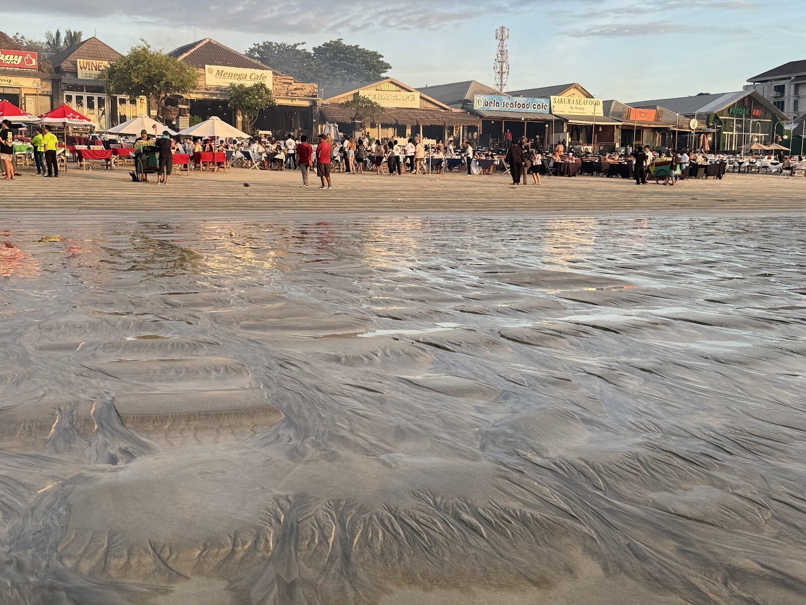 The working beachfront where the warungs and buildings back onto the sand.