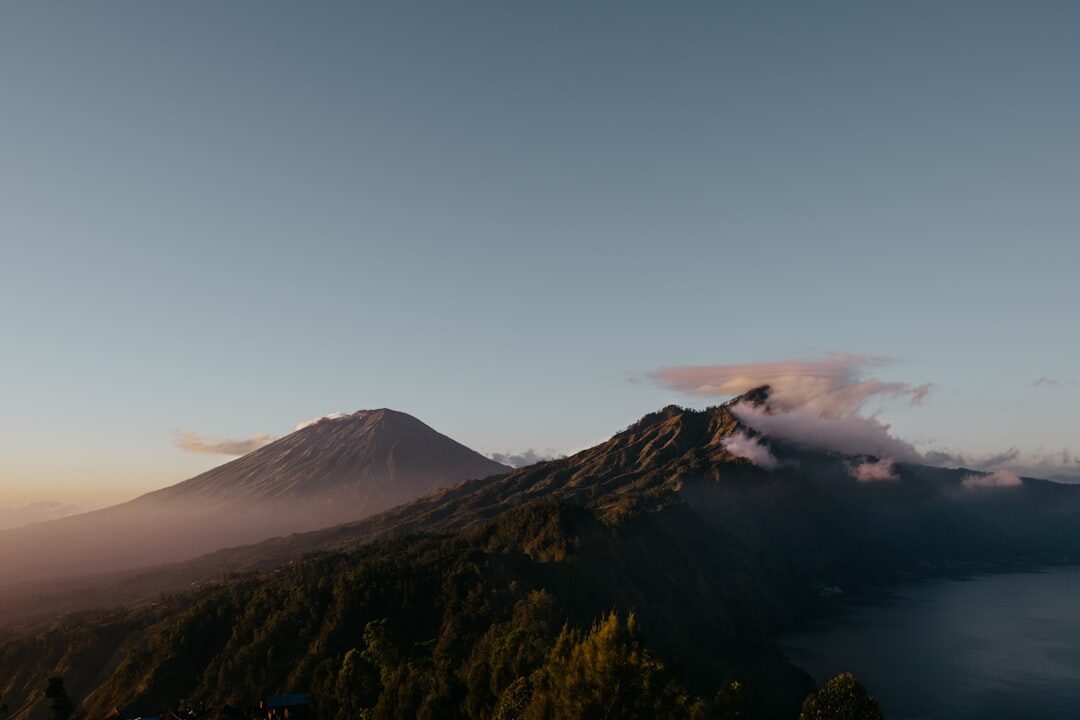 Mount Agung at sunrise — the peak tends to clear early and cloud over by midday.