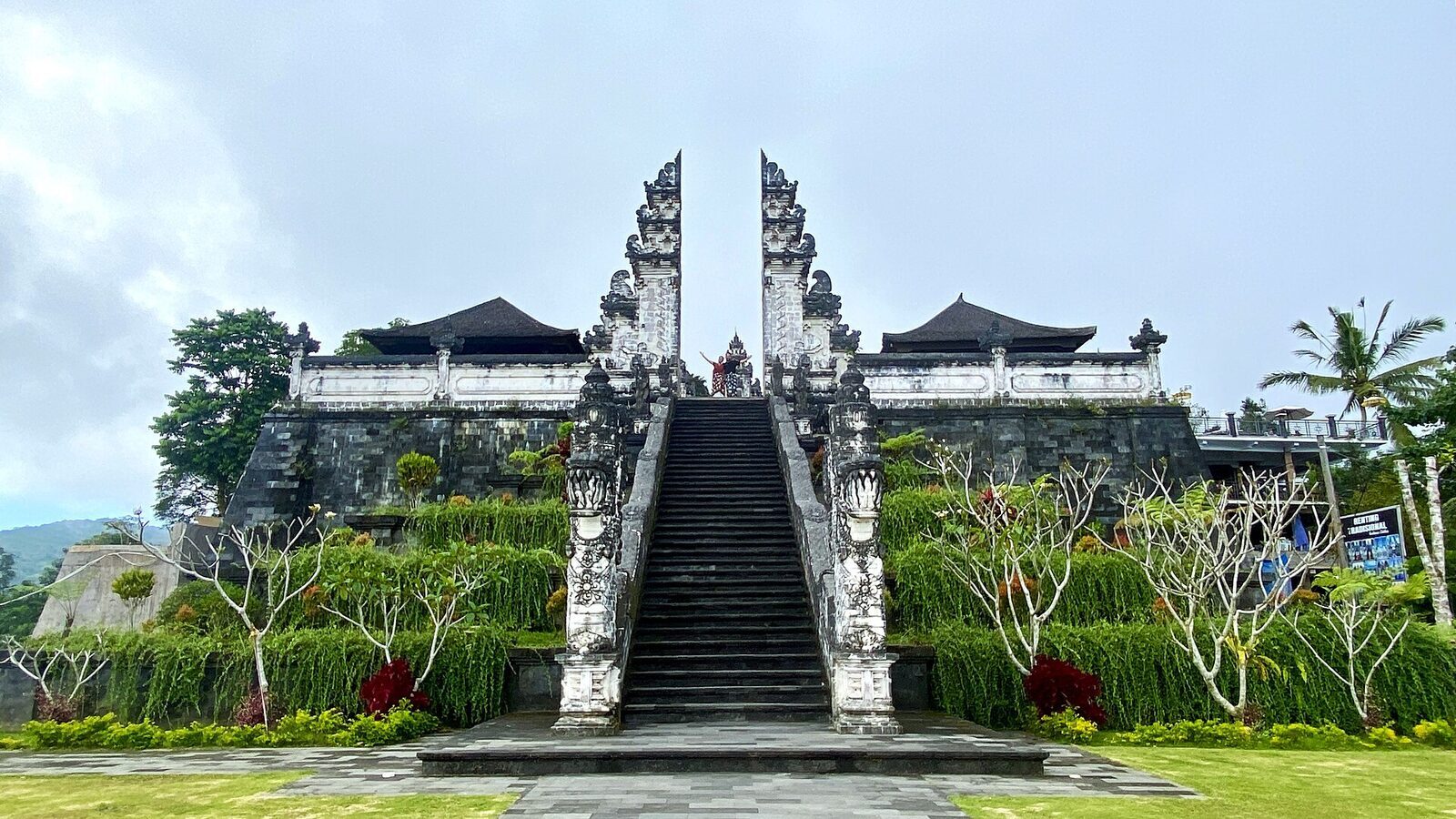 The gate from the plaza, with the ceremonial stairway climbing behind it.