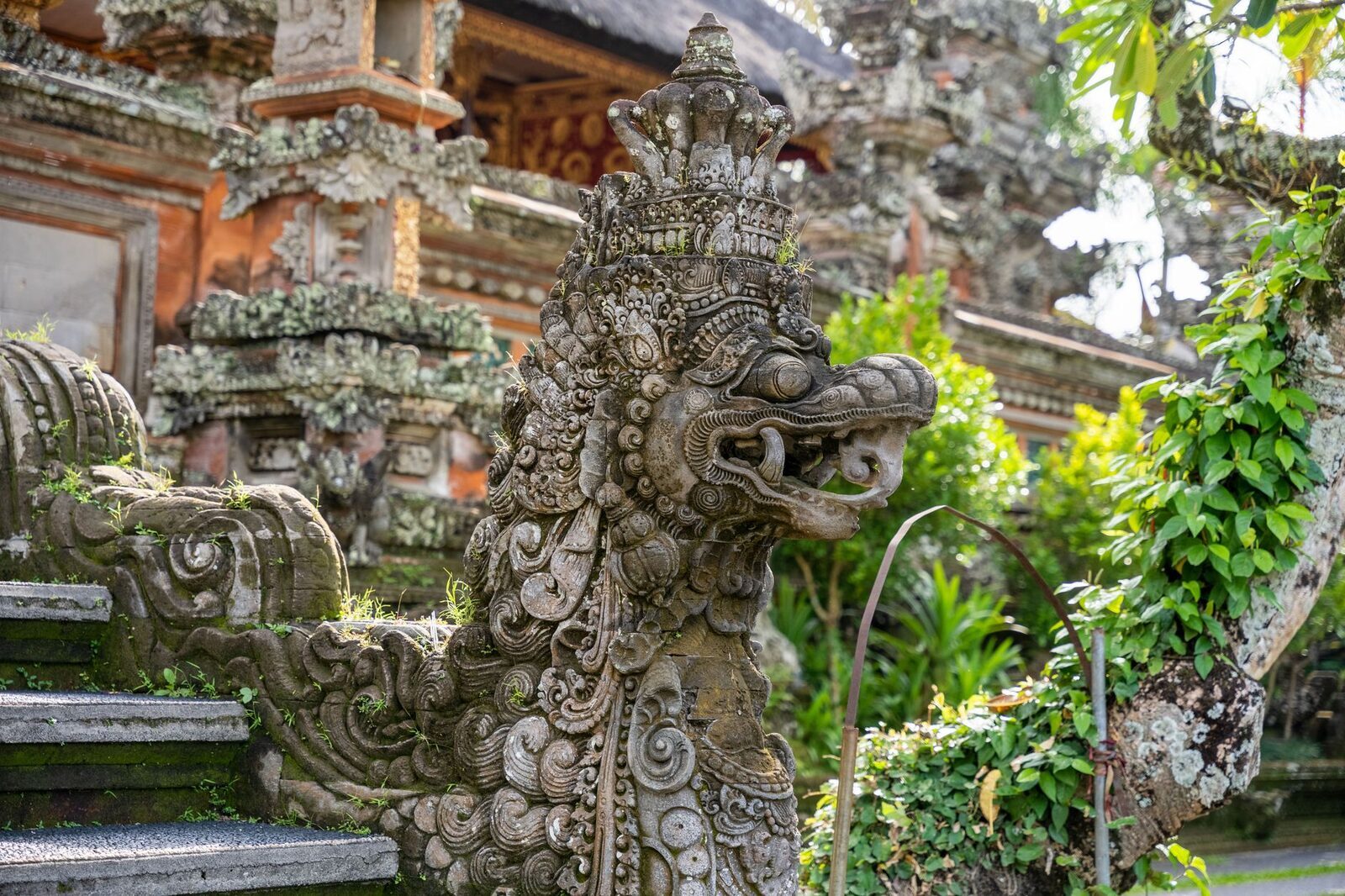 Close detail of a carved temple guardian along the route up.