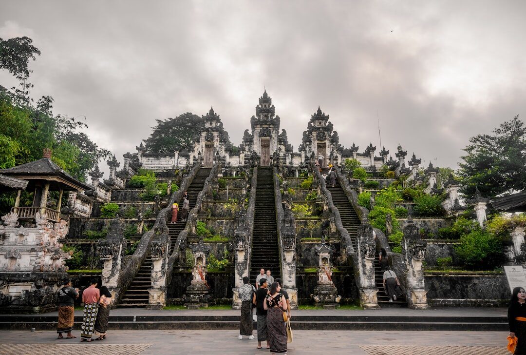 The grand ceremonial stairway climbing past the gate — the start of the long ascent almost no day-tripper makes.