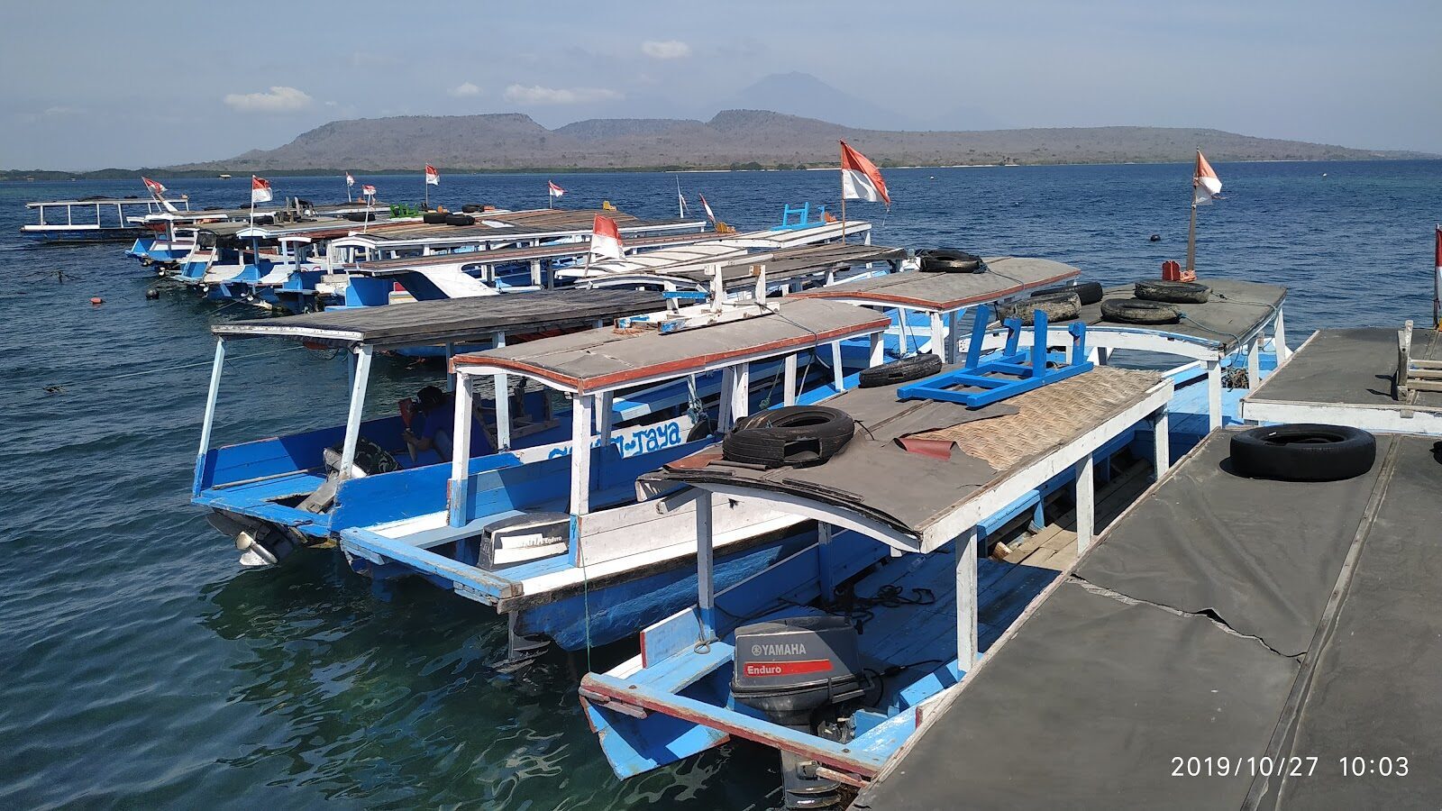 Floating docks and small boats at Labuan Lalang, the mainland jumping-off point.