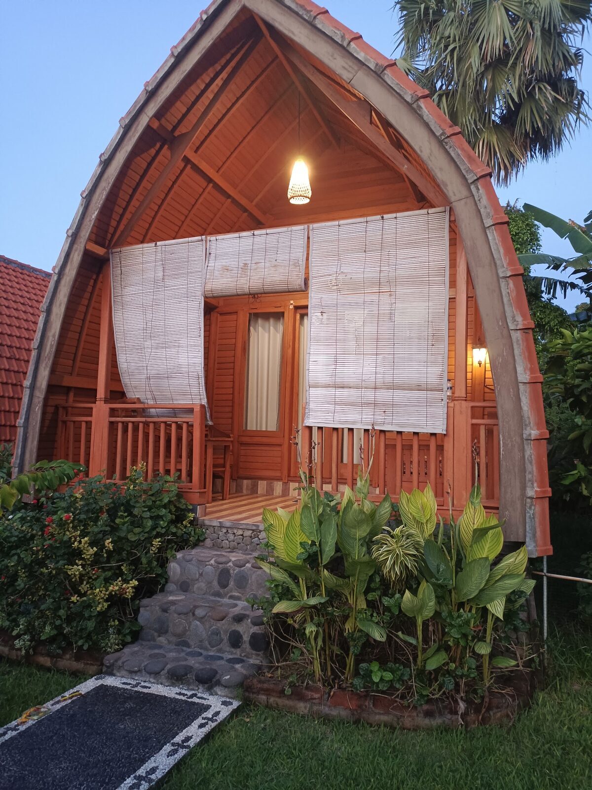 A lumbung-style bungalow in Pemuteran — the low-key village where Menjangan divers stay.