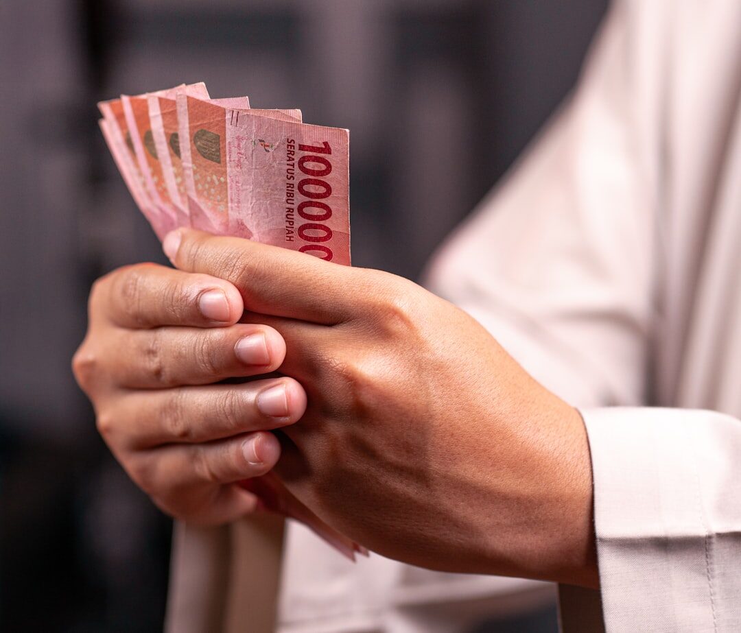 The little red 10,000s — small change for parking, warungs and temple donations.