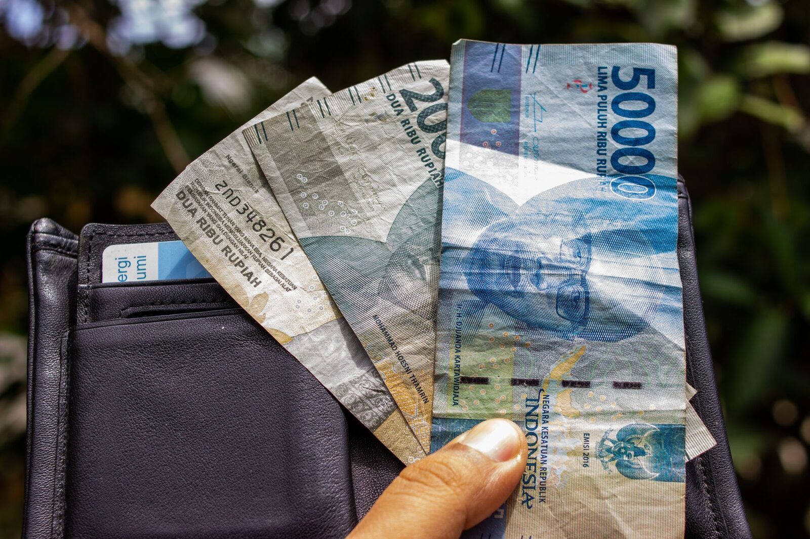 A wallet of 50,000s and 20,000s. Carry a day's worth, not a fortune; leave the rest and the backup card in the room.