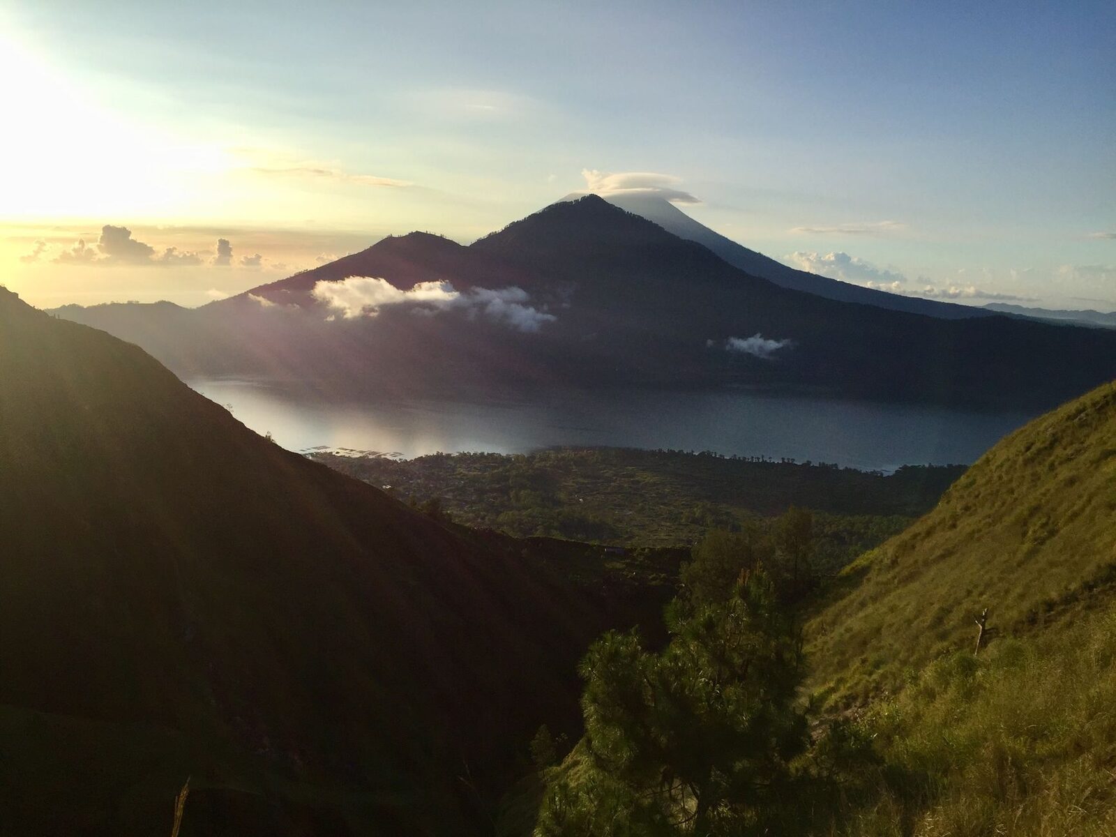 Batur's cone above a sea of cloud at sunrise.