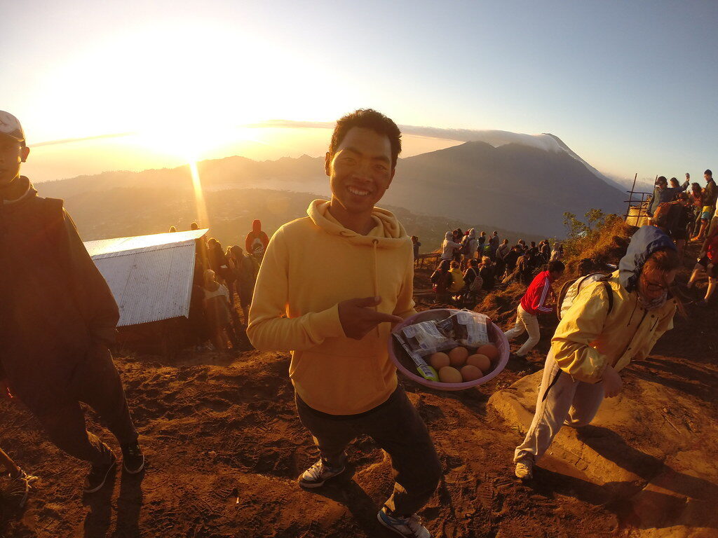 Breakfast at the top of Batur with the sunrise crowd — this trek is popular, and it shows.