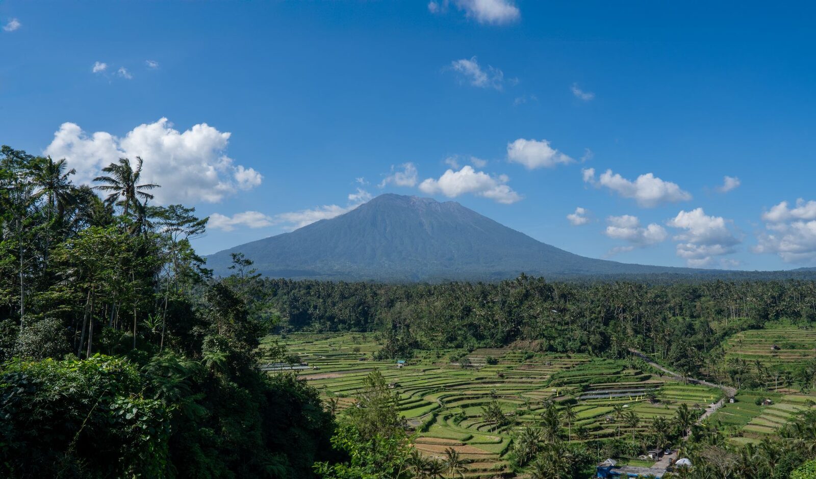 The volcano standing over east Bali's rice terraces — the sacred kaja pole made scenery.