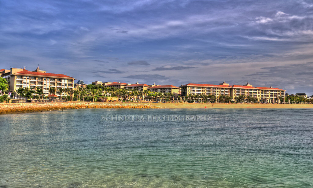 A resort building set right on the calm water.