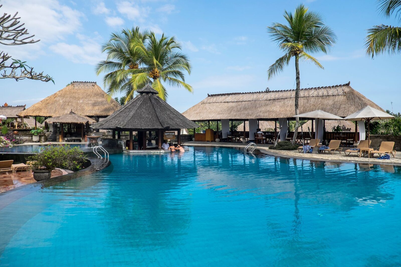 A tropical hotel pool — the manicured version of Bali the enclave sells.