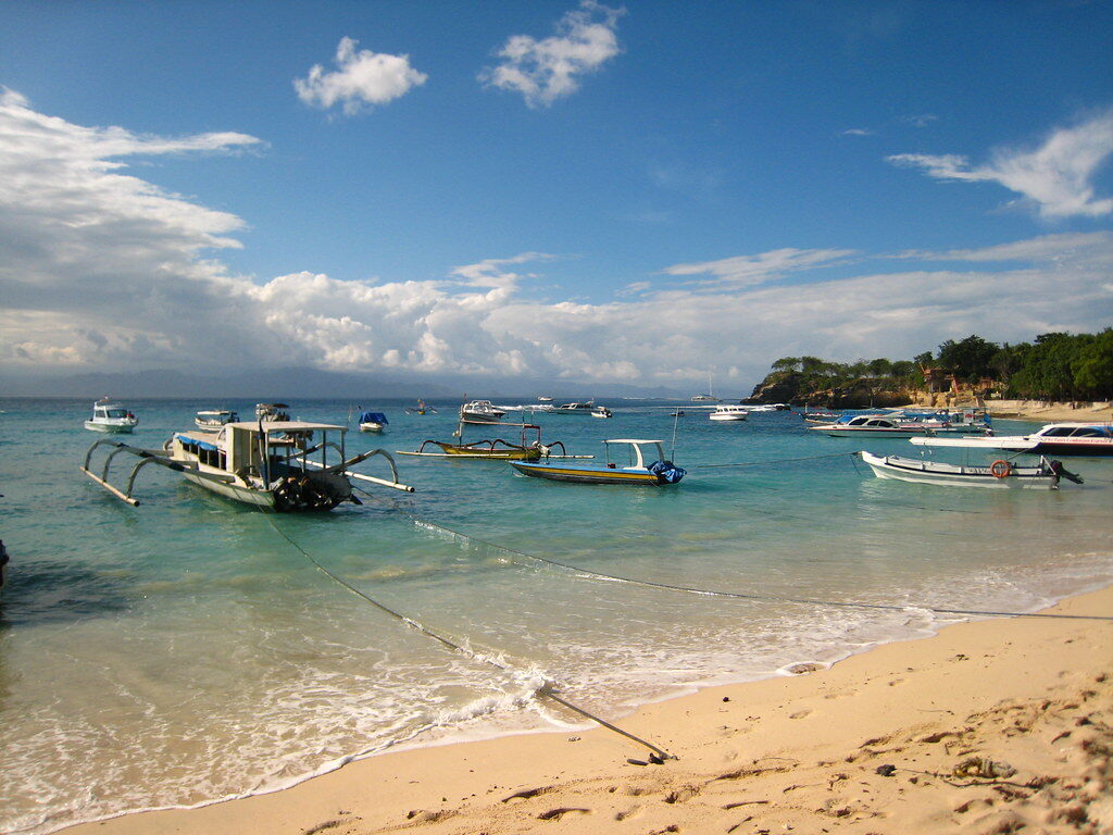 Traditional jukung outrigger boats drawn up on a Lembongan beach.