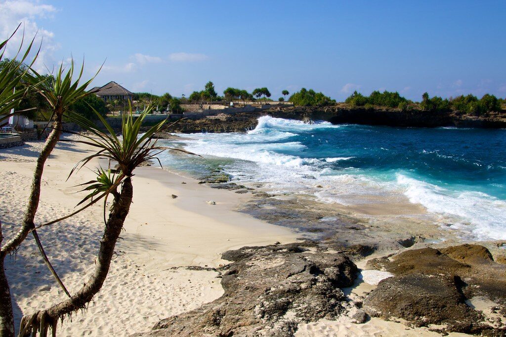 Dream Beach — the crescent of white sand next to the Devil's Tear cliffs.