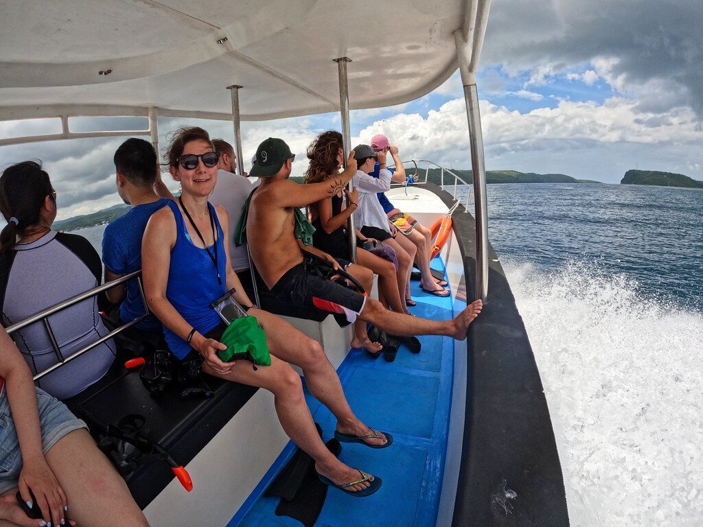 A guided snorkel boat heading out — the low-stress way to handle the current and the manta timing.