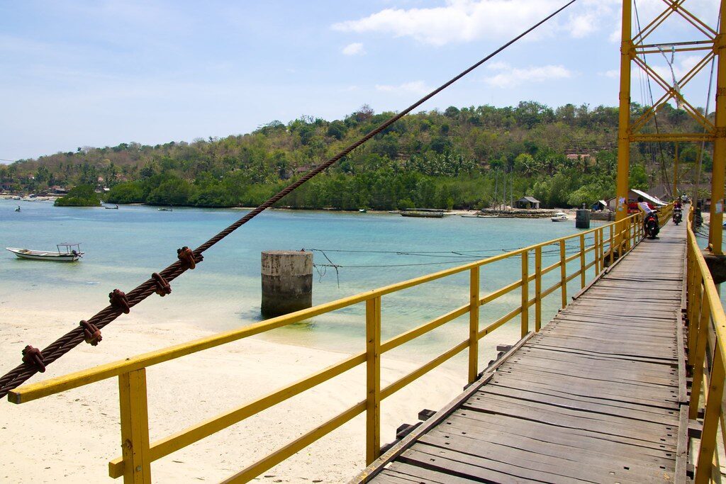 Crossing the timber deck of the Yellow Bridge on foot.
