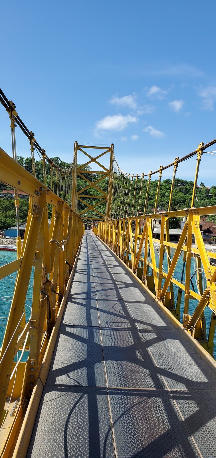 The bridge walkway, turquoise water either side.