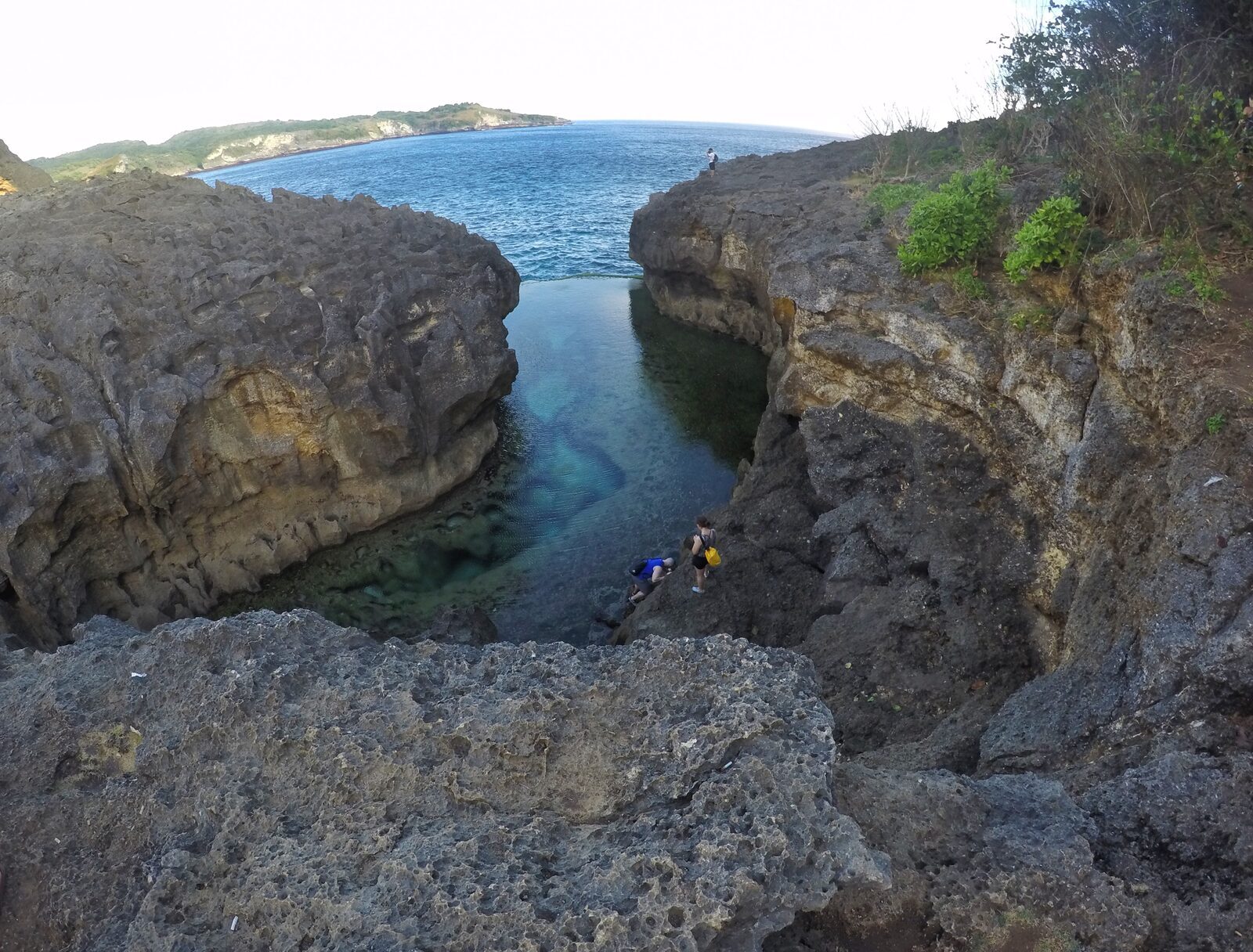 Snorkellers in the clear channel of Angel's Billabong.