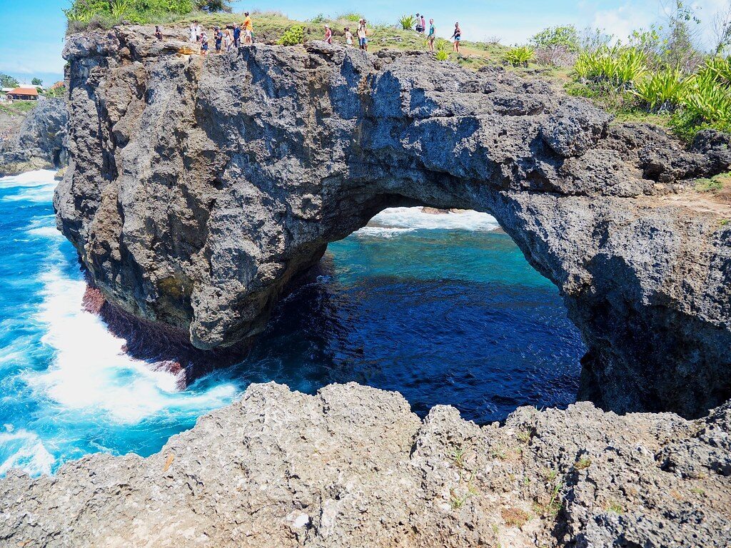 The sea passing under the Broken Beach arch.