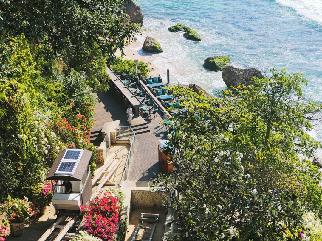 The maze of steep steps down past a cliff warung to the water.