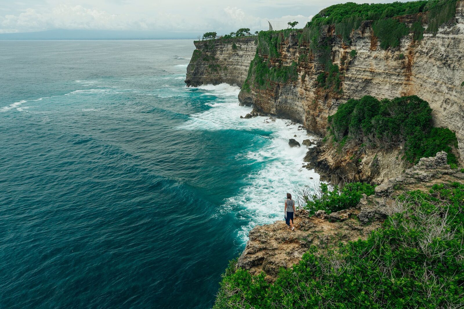 The tall Bukit sea-cliffs that back these beaches — a real hike down and up.