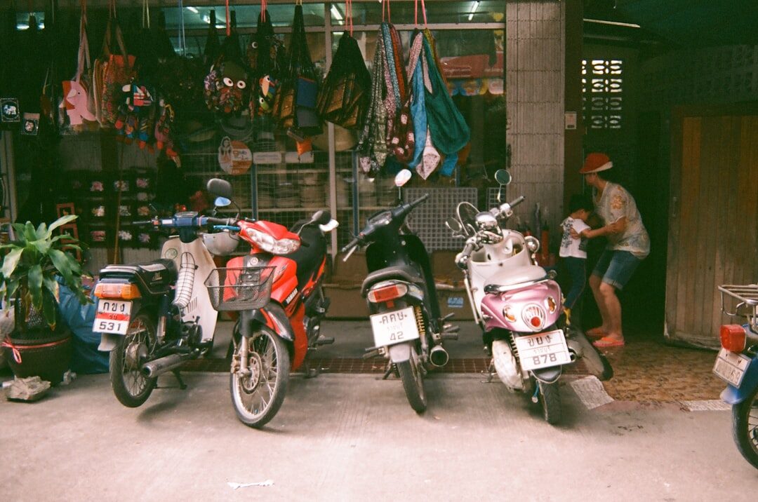 A couple of scooters parked outside a small shop — the kind of fixed-address place worth renting from.