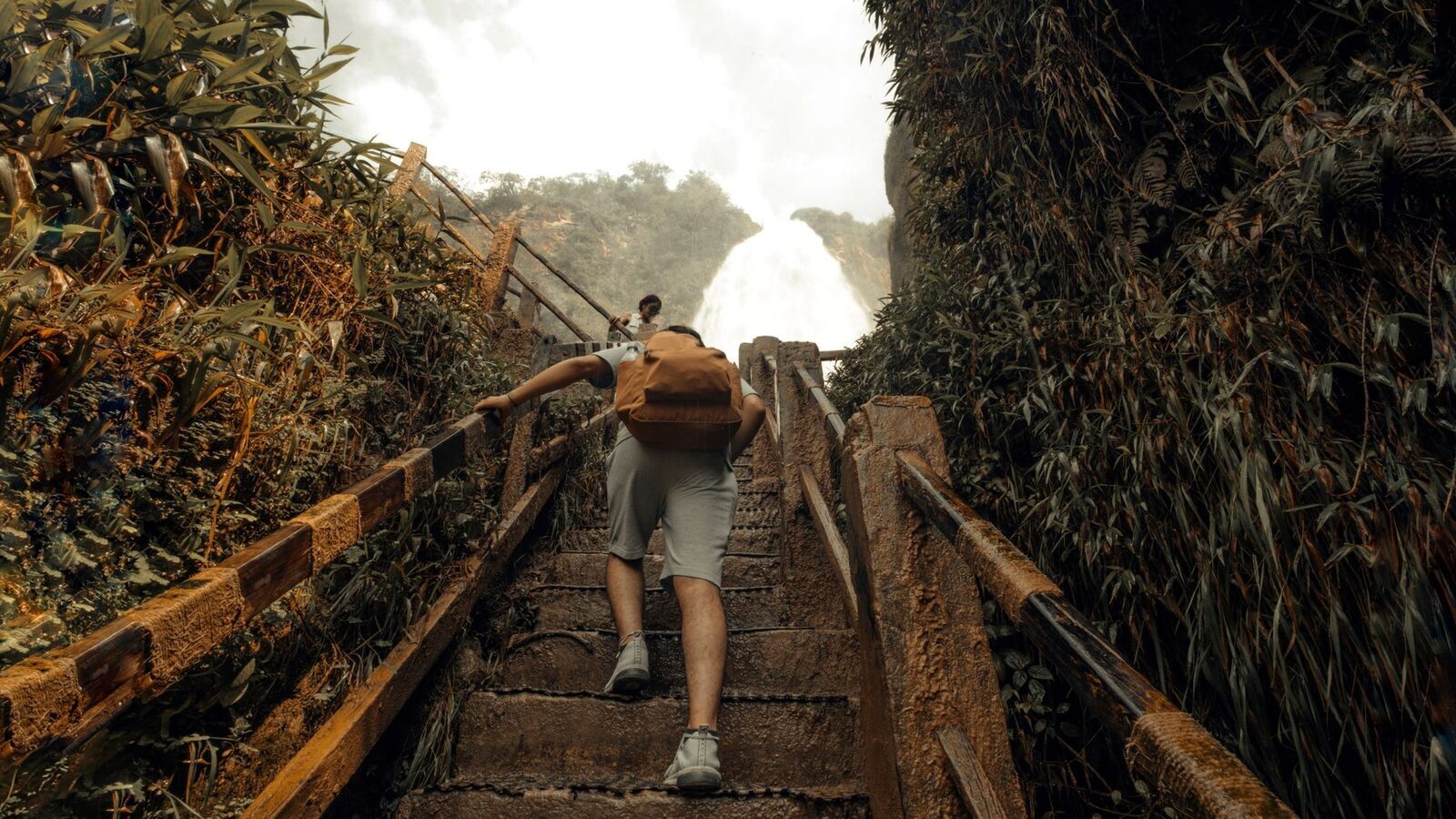 The way in and out: a long staircase and dirt path dropping from the rim into the gorge.
